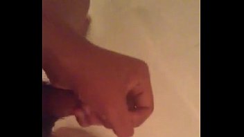 Slapping hard cock in shower